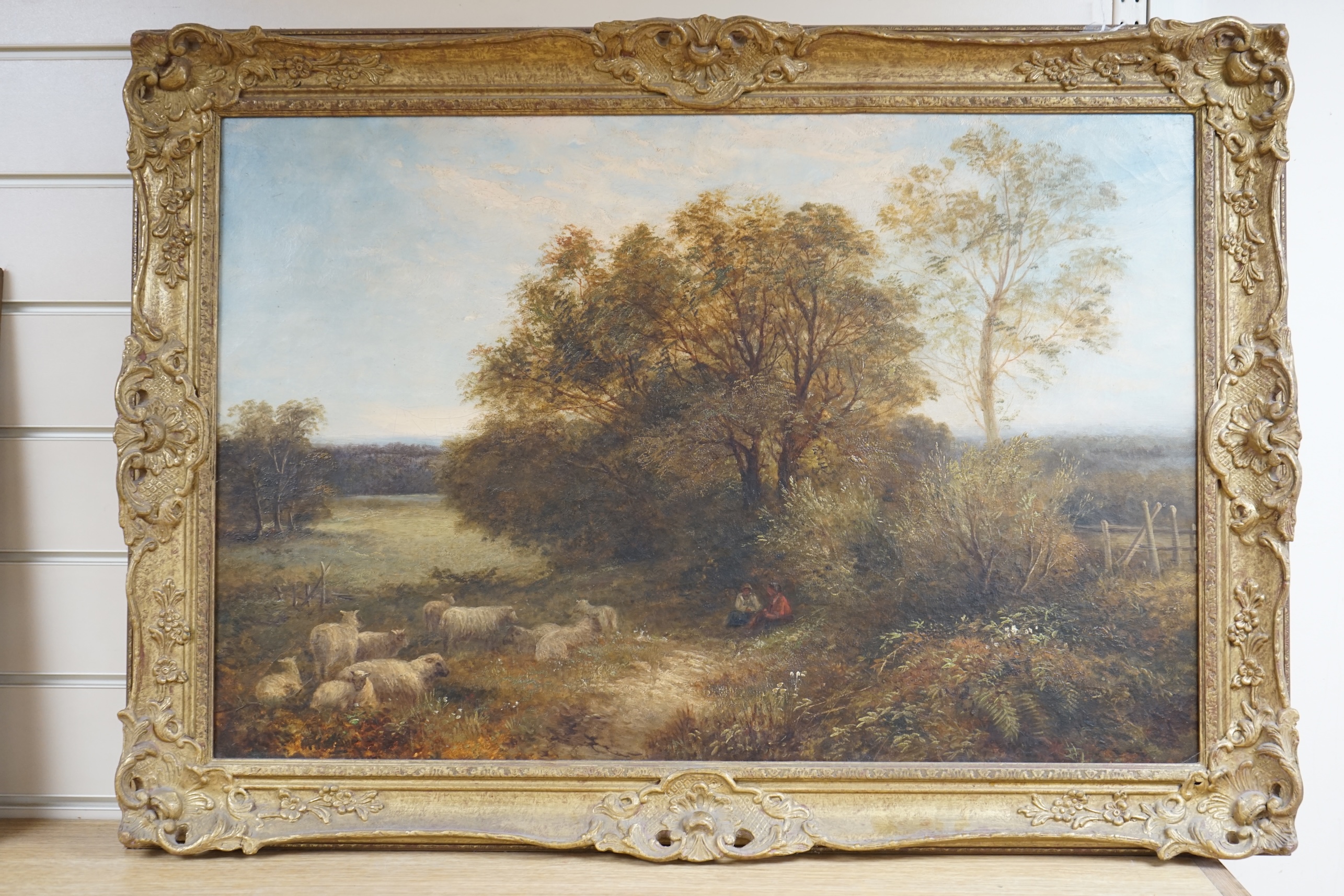 19th century, English School, Riverside landscape with figures and sheep, unsigned, 49 x 74cm, ornate gilt framed. Condition - fair, craquelure throughout